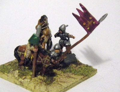 Norman General
one extra horseman added to what is sold as a mini diorama, complete with rock. Code :  VIK COM 8 - William II (William Rufis) 1087 – 1100 William standing on large rock pointing, sword in hand, Un-armoured groom hanging from William’s rearing horse (two piece casting), and AN 43(N) standard bearer (plus extra figure)
Keywords: Norman