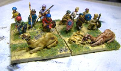 Warriors defending behind camels
