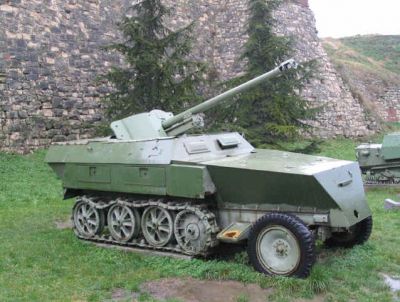 Sdkfz 250/22 with a Russian gun
Photos taken by my brother at Belgrade Army Museum Probably a Russian copy of a Sdkfz 250/22 with a Russian gun - note the very odd wheel arrangement for the tracks maybe marking it out as a non-genuine German 250. Although I have been emailed by Darko Simac from Serbia to say that the odd wheel arrangement is because some of the wheels are missing, and it is in fact a proper German one. Probably the only surviving one in the world. 
