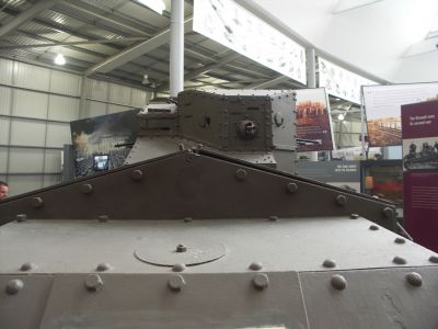Medium Mark A Whippet
This armoured fighting vehicle was intended for fast mobile assaults. Although the track design appears more "modern" than the British Tanks Mark I to V, it was directly derived from Little Willie, the first tank prototype, and was unsprung. The crew compartment was a fixed, polygonal turret at the rear of the vehicle, and two engines of the type used in contemporary double-decker buses were in a forward compartment, driving one track each.
