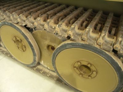 The Tiger I
The suspension used sixteen torsion bars, The wheels had a diameter of 800 mm (31 in) and were overlapped and interleaved, providing unprecedented uniform distribution of the load onto the track, at the cost of increased maintenance. Removing an inner wheel that had lost its tire (a common occurrence) therefore required the removal of up to nine outer wheels.

