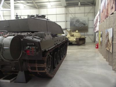 T62 vs Challenger
The T-62 uses torsion bar suspension. It has five pairs of rubber-tired roadwheels, a drive sprocket at the rear and idler at the front on each side, with no return rollers. The first and last roadwheels each have a hydraulic shock absorber. The tank is powered by the V-55 12-cylinder 4-stroke one-chamber 38.88 litre water-cooled diesel engine developing 581 hp (433 kW) at 2,000 rpm
