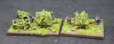 88mm AA/AT guns 
Crew may be a random selection from various companies
